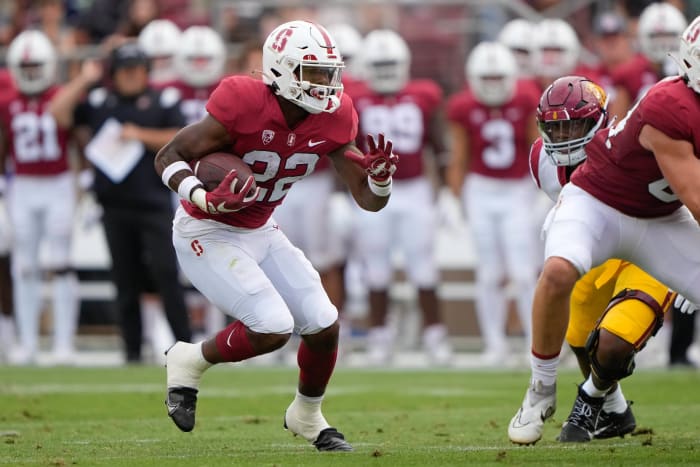 Sep 10, 2022; Stanford, California, USA; Stanford Cardinal running back E.J. Smith (22) runs with the football during the first quarter against the USC Trojans at Stanford Stadium. Mandatory Credit: Stan Szeto-USA TODAY Sports